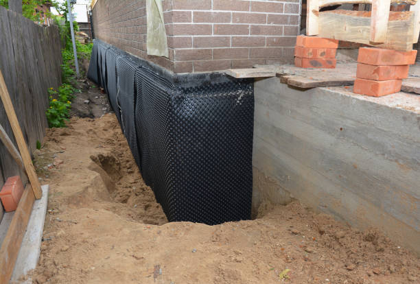 Happy homeowners after waterproofing job in Indian Mound